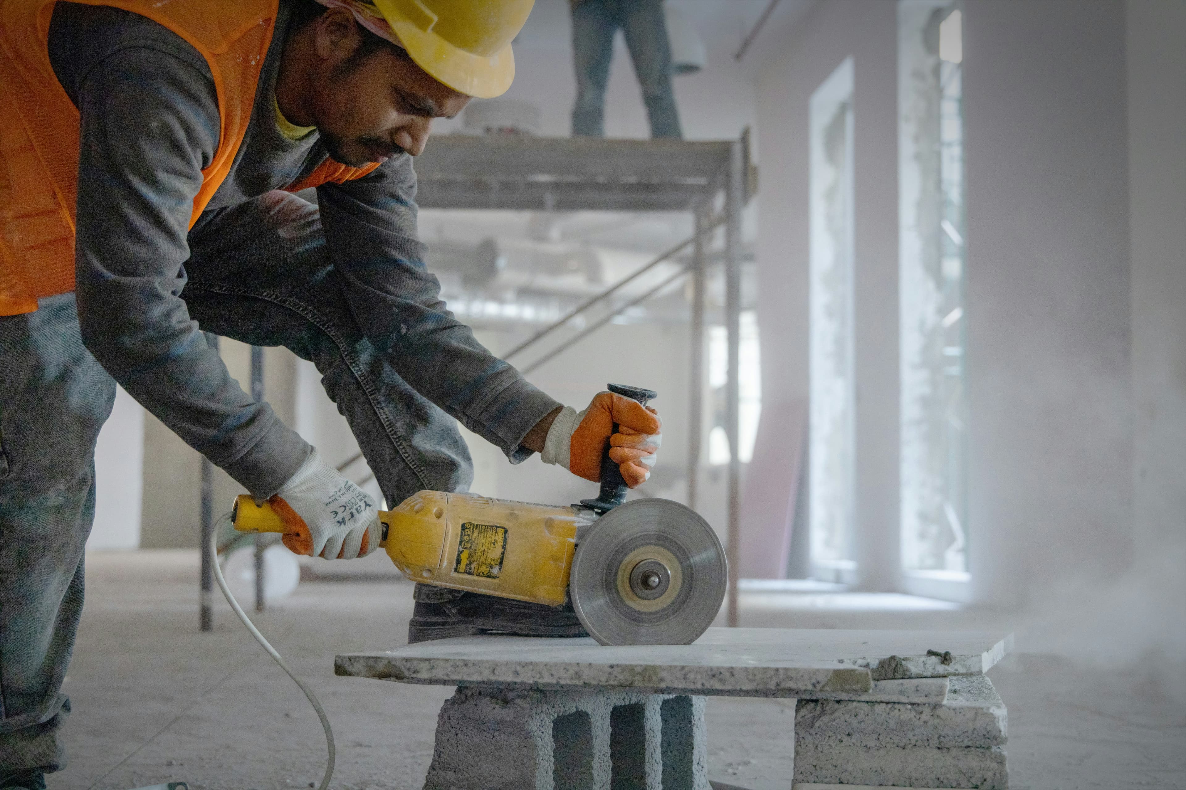 Tradesperson on site reviewing a job